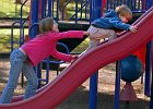HelpingHand--LandrumPark copy  Talia Petoia, 9, lends a helping hand to her brother, Jeremiah Petoia, 4, as he trys to get up a slide, while the siblings, from Tryon, NC, play at Brookwood Park in Landrum Wednesday afternoon, 10-26-05.   (NOTE: Stand-alone Feature)
